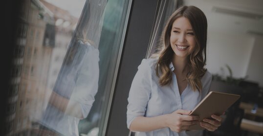 woman on window smiles it jobs timetoact group