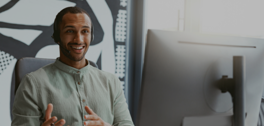 Handsome african businessman working computer while sitting in modern coworking