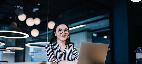 Happy woman working with laptop