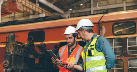 professional technician engineer working to check safety system of heavy industry manufacturing machine in construction plant and service a factory equipment of production job technology