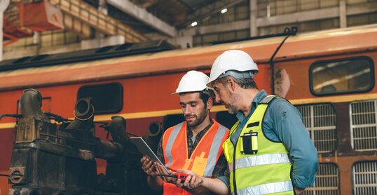 professional technician engineer working to check safety system of heavy industry manufacturing machine in construction plant and service a factory equipment of production job technology