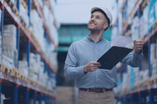 Man walks through a large warehouse